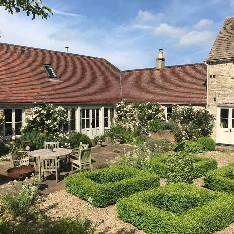 Topiary in courtyard at Well Farm Gloucestershire